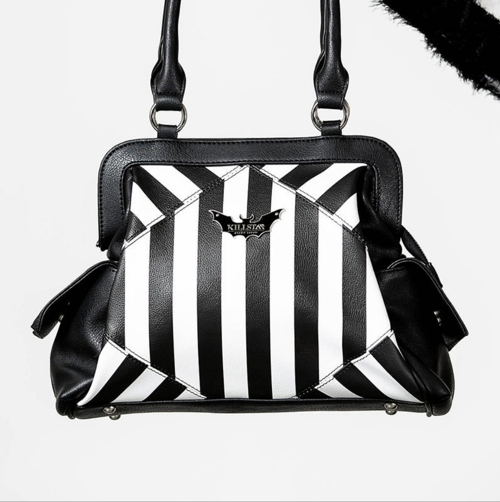 NEVER TRUST THE LIVING HANDBAG